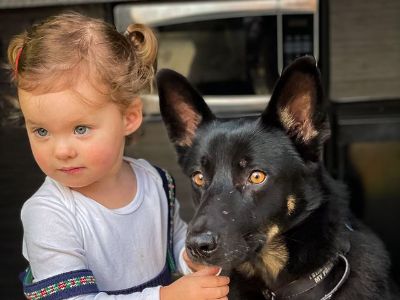 Olivia is touching Boey's face as they both are looking at something.